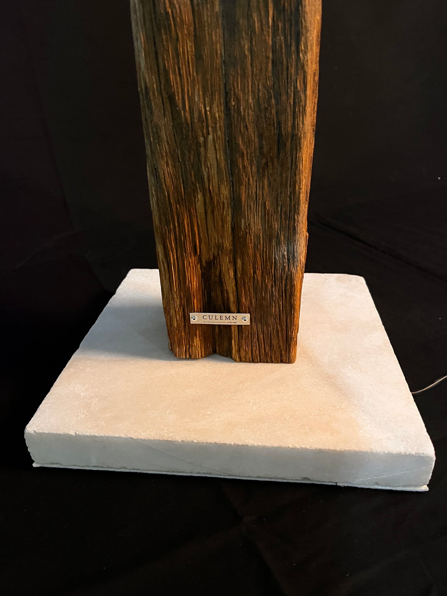 The lamp with 2 LED strips made of 450-year-old oak with a white LIFTER marble base
